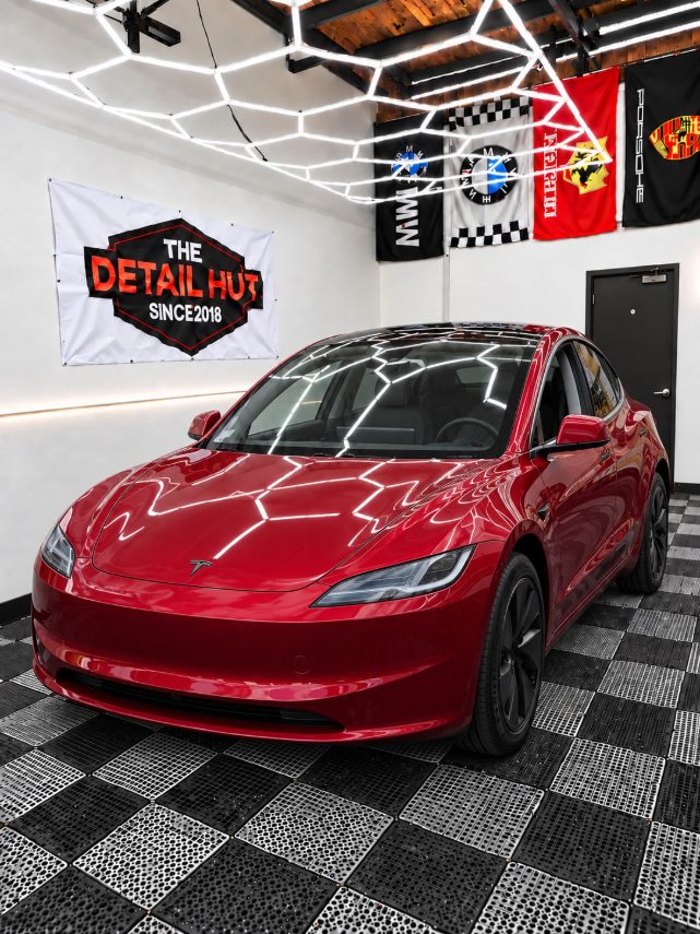 Red Tesla Model 3 in The Detail Hut install bay